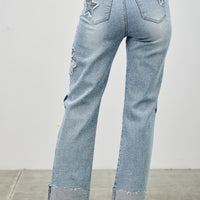 High Rise Star & Heart Patched Dad Jean W/stretch showcasing star patchwork and relaxed straight-leg silhouette.