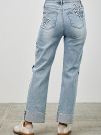 High Rise Star & Heart Patched Dad Jean W/stretch showcasing star patchwork and relaxed straight-leg silhouette.