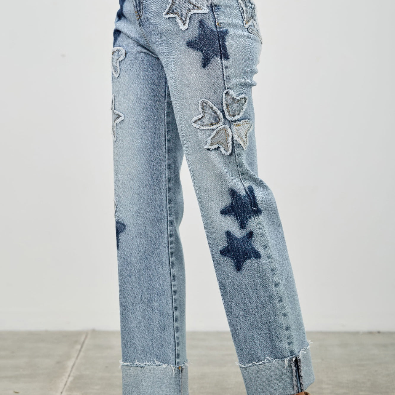 High Rise Star & Heart Patched Dad Jean W/stretch featuring star patches and a relaxed fit.