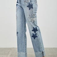 High Rise Star & Heart Patched Dad Jean W/stretch featuring star patches and a relaxed fit.