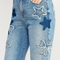 High Rise Star & Heart Patched Dad Jean W/stretch featuring playful star patchwork on light denim.