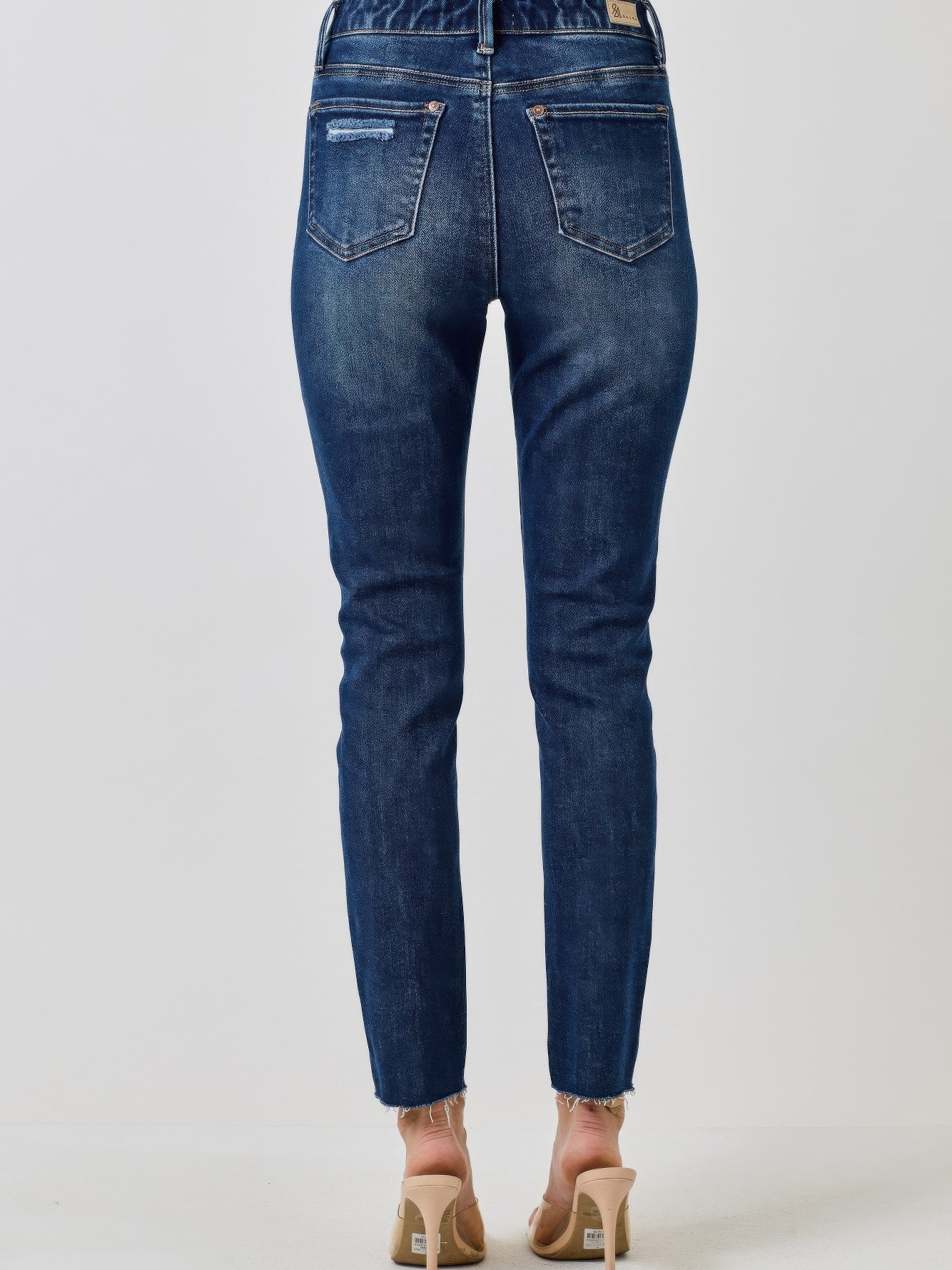 High Rise Ankle Skinny With Button Fly - Back view showing the sleek, form-fitting design and vintage-inspired details.