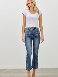 Model wearing Mid Rise Skinny Crop Tummy Control jeans, showcasing a flattering fit and cropped length.