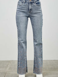 High Rise Kick Flare With Rhinestone paired with white boots, showcasing subtle rhinestone detailing on denim.