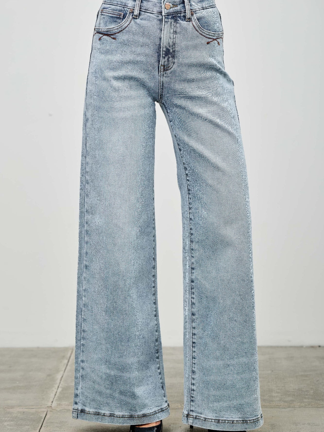 High Rise Wide Leg jeans in light wash with a relaxed fit and classic five-pocket styling.