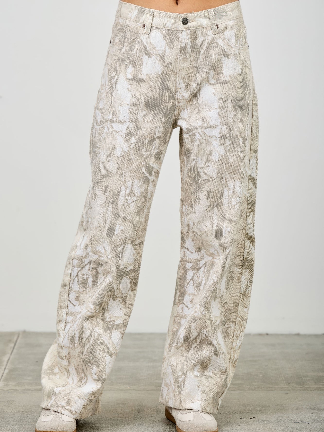 High Rise Low Curve Barrel jeans with a unique printed design and contemporary silhouette, showcasing a flattering high-rise fit.