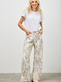 Model wearing High Rise Low Curve Barrel jeans with an eye-catching design and contemporary silhouette.