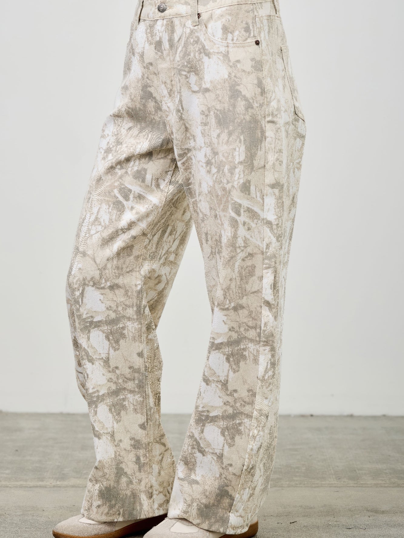 High Rise Low Curve Barrel jeans featuring a contemporary silhouette and eye-catching printed design.