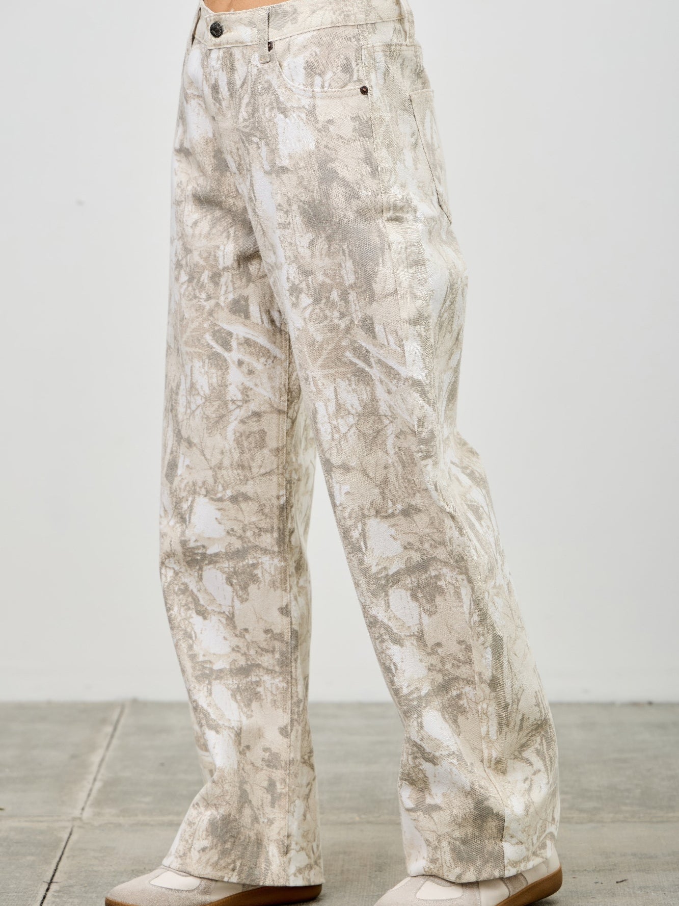 High Rise Low Curve Barrel jeans with printed design, featuring a high-rise waist and barrel leg silhouette.