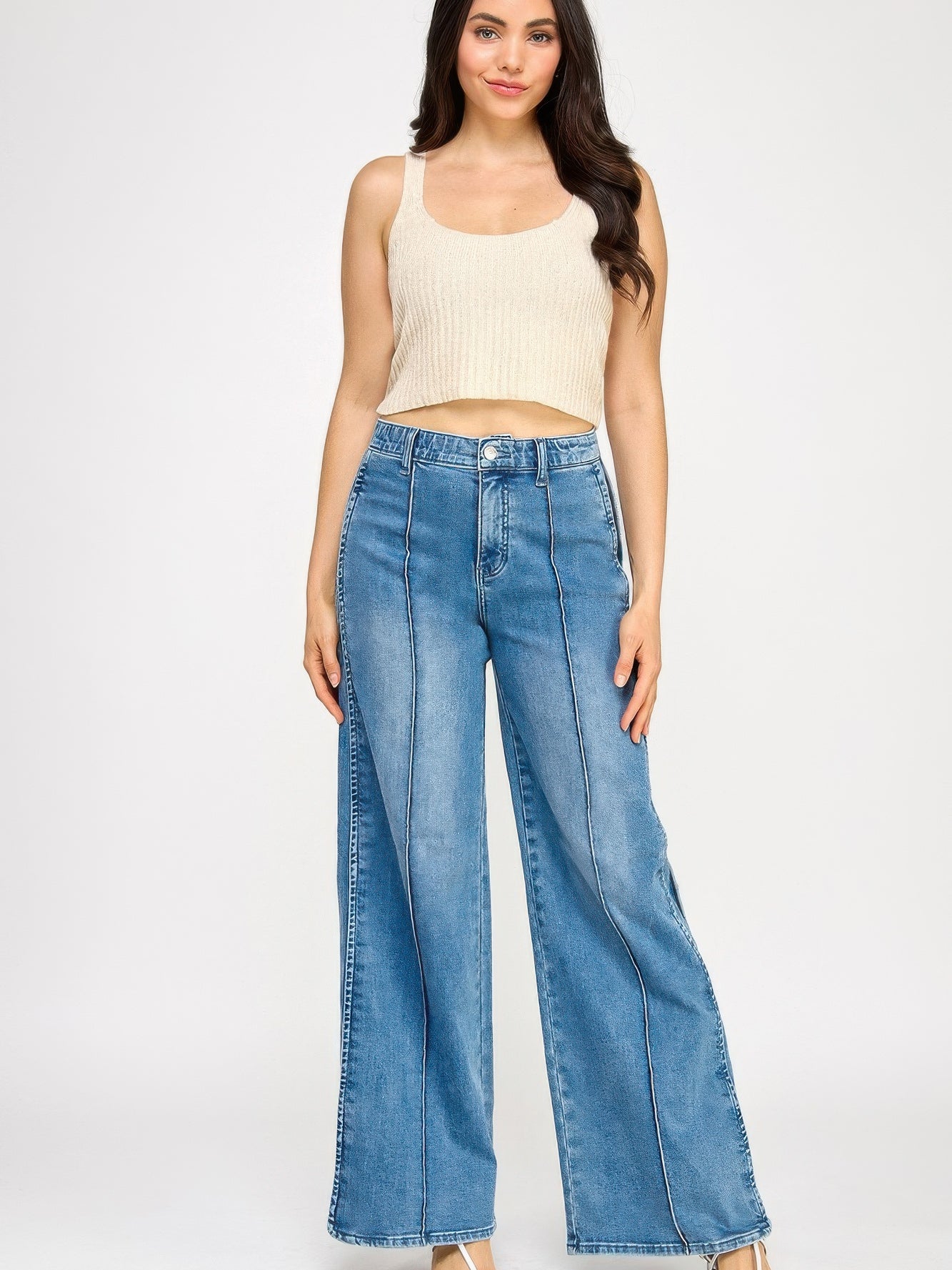 Model wearing High Rise Wide Leg With Tummy Control jeans, showcasing a flattering fit and stylish design.