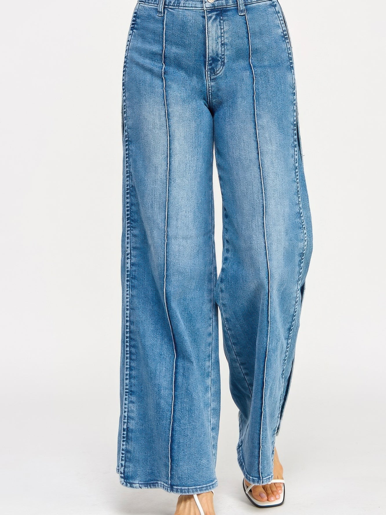 High Rise Wide Leg With Tummy Control jeans in light blue with wide leg silhouette and supportive waistband.