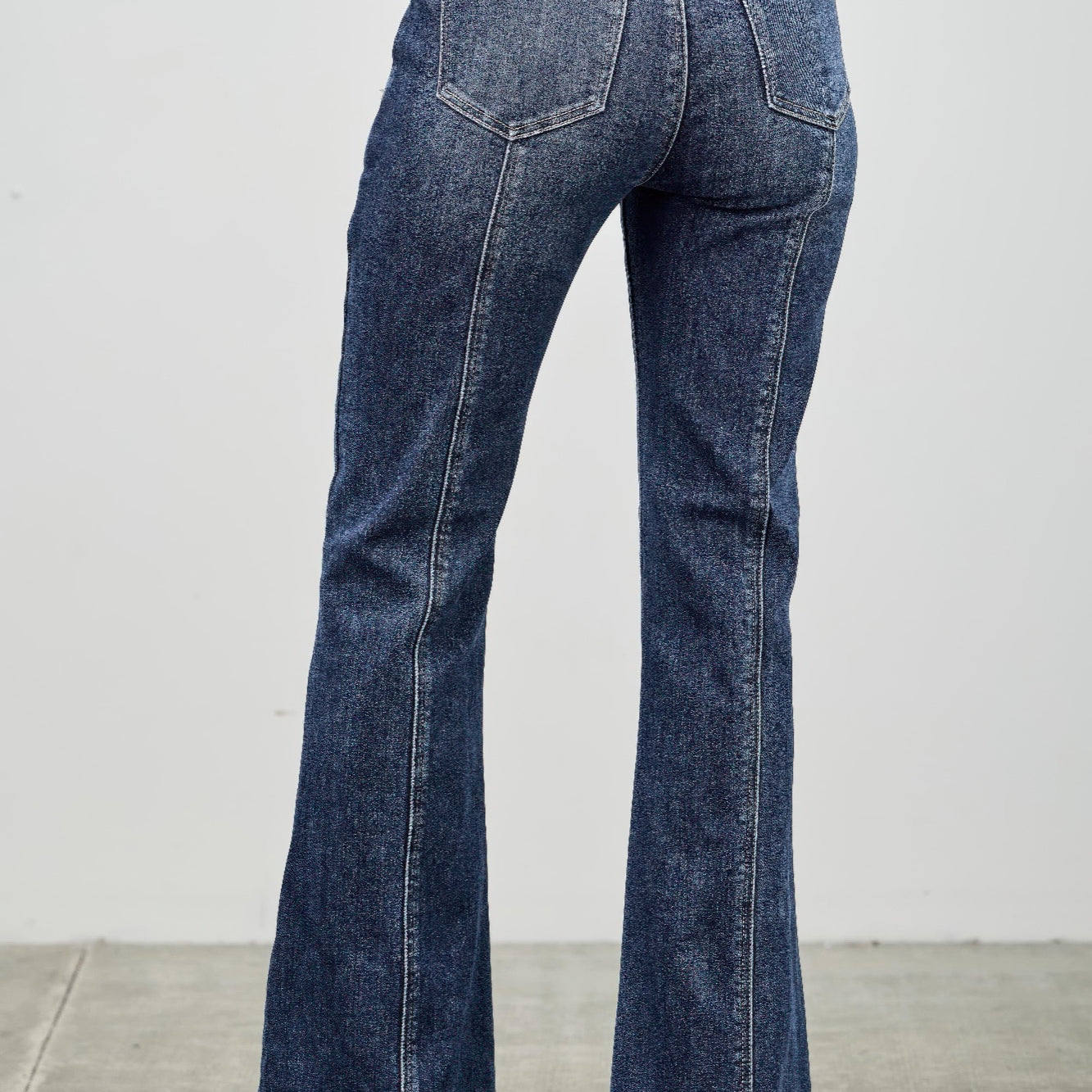 High Rise Boot Cut With Seam Detail showcasing the back view and flared hem in soft, stretch denim.
