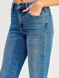 Tummy Control Mid Rise Skinny Bootcut jeans showcasing a flattering fit with a mid-rise waist and soft stretch denim.