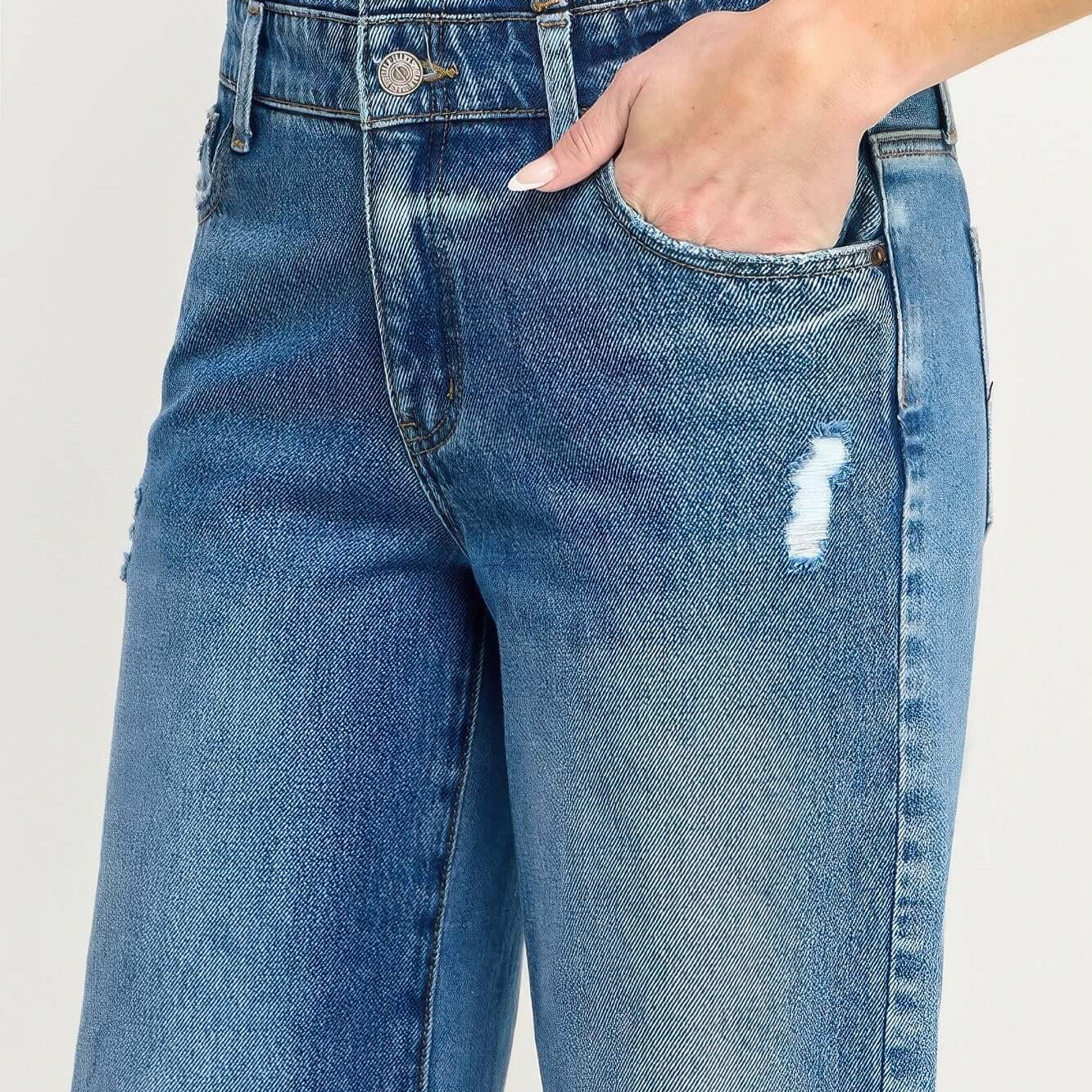 Close-up of High Rise Double Waist Wide Leg jeans showcasing double waistband and stylish distressing details.