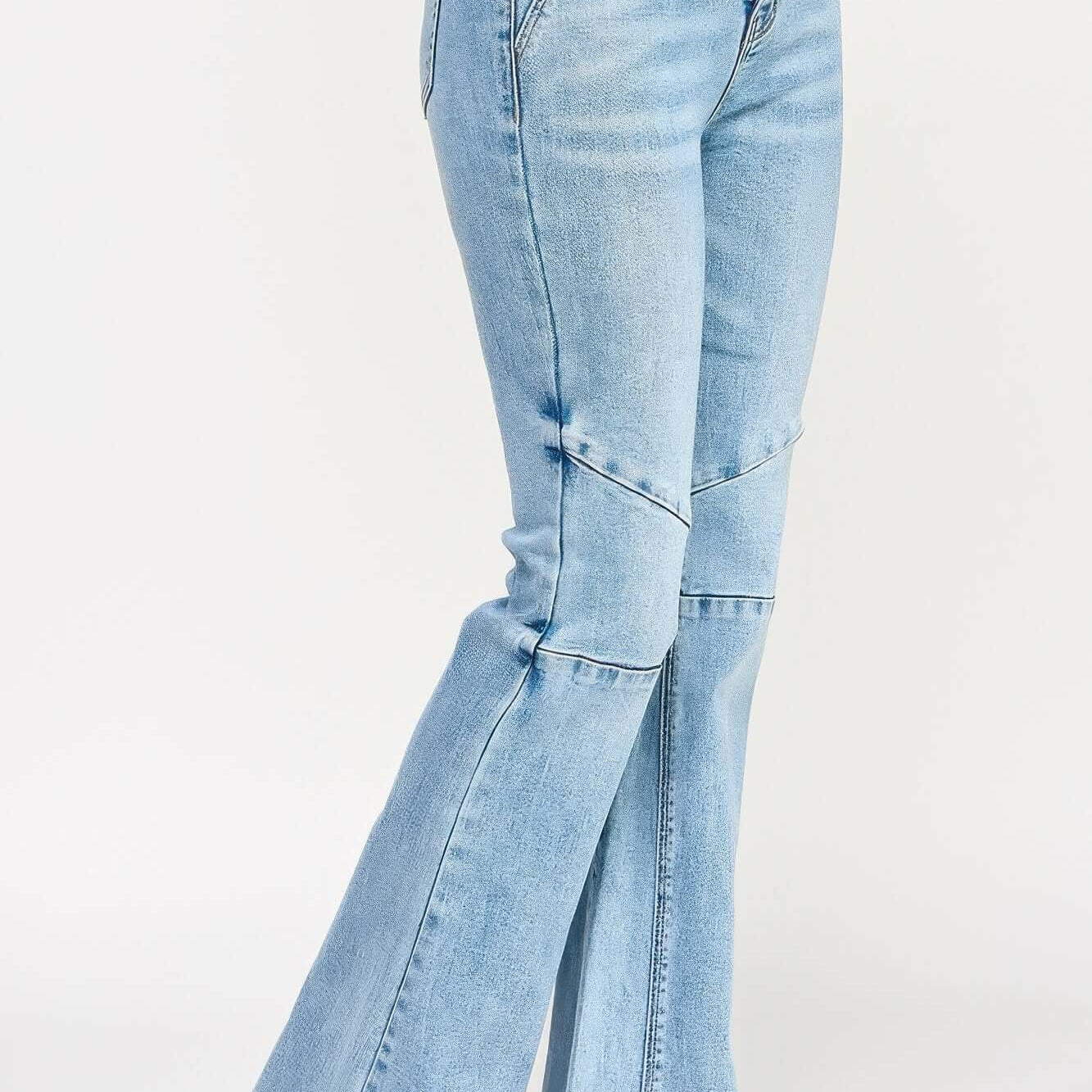High Rise Flare With Seam Detail showcased in light blue denim, featuring a stylish flare and elongating seams.