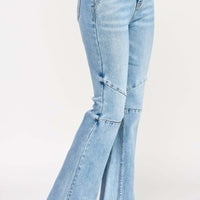 High Rise Flare With Seam Detail showcased in light blue denim, featuring a stylish flare and elongating seams.