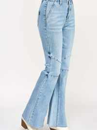 High Rise Flare With Seam Detail showcased in light blue denim, featuring a stylish flare and elongating seams.