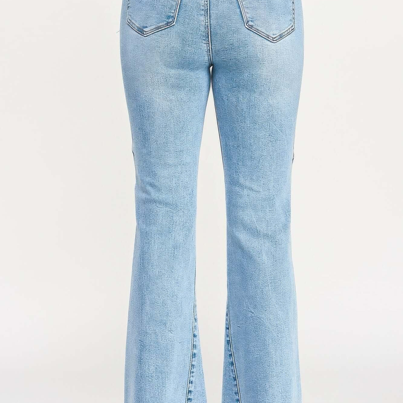 High Rise Flare With Seam Detail showcasing the back view of stylish blue flare jeans with seam accents.
