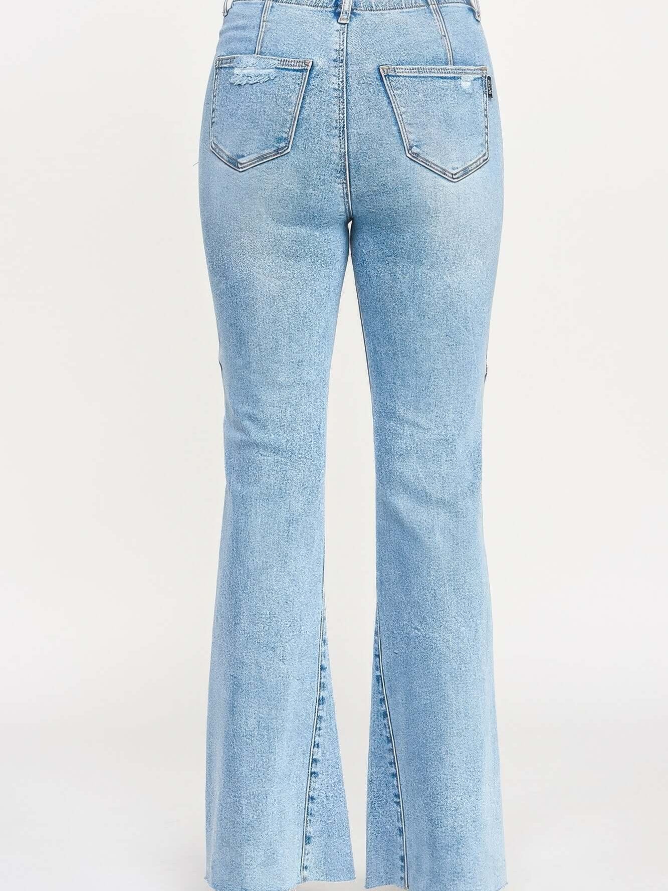 High Rise Flare With Seam Detail showcasing the back view of stylish blue flare jeans with seam accents.