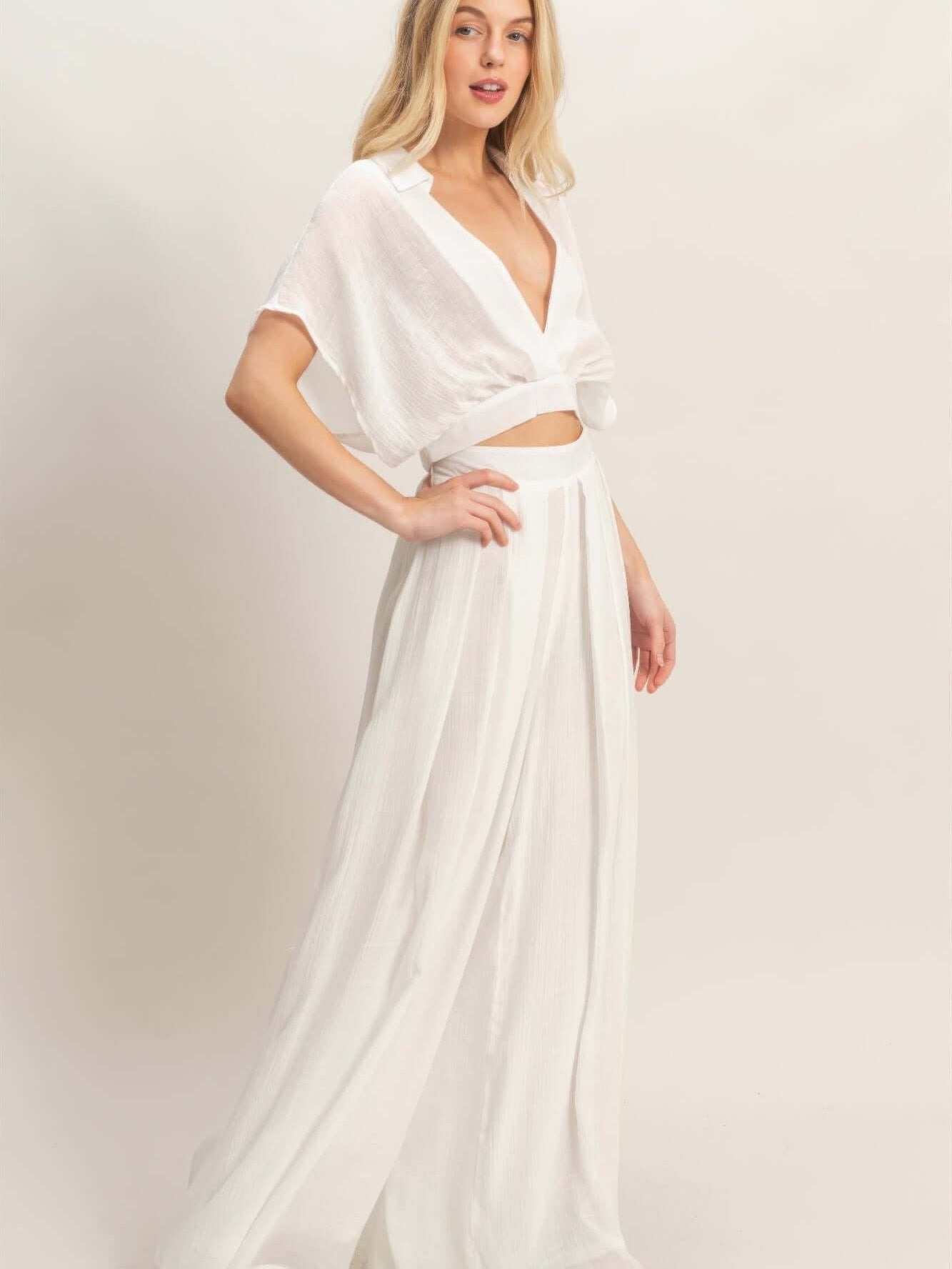 Collared Wrap Top & Wide-leg Pants Set worn by model, showcasing a chic and sophisticated look in white.