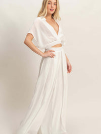 Collared Wrap Top & Wide-leg Pants Set worn by model, showcasing a chic and sophisticated look in white.