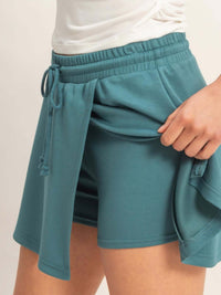 Wrap Front Elastic Waist Skort featuring a comfortable elastic waistband and stylish wrap detail.