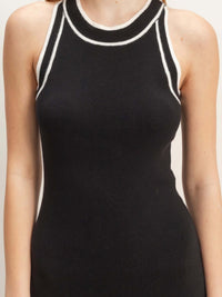 Ribbed Sleeveless Dress featuring a sleek black design with white detailing for a modern look.