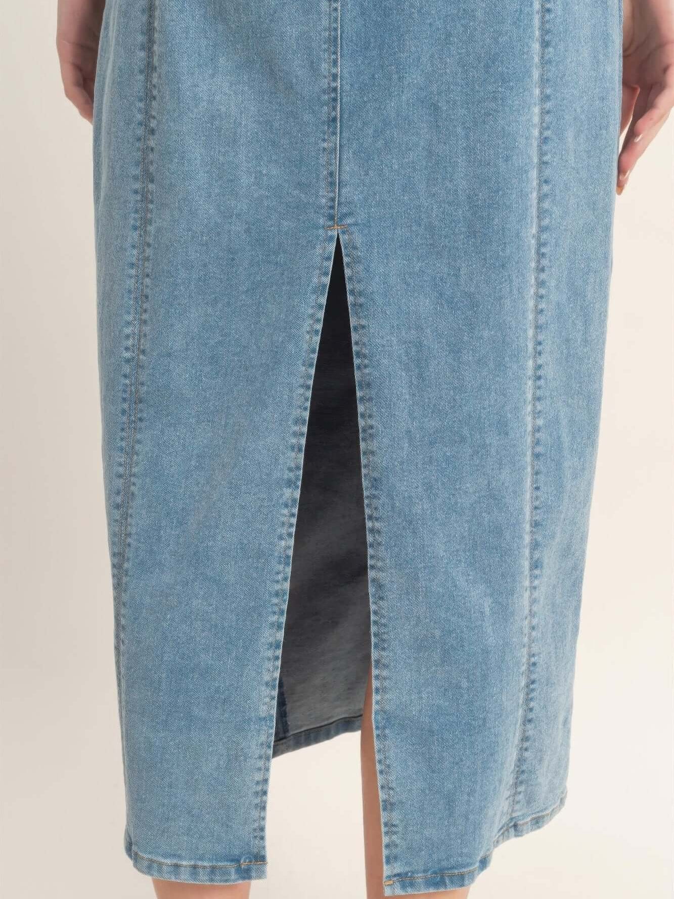 Back view of Sleeveless Denim Midi Dress showcasing the slit detail and soft blue fabric.