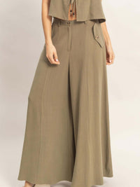 Wide-leg Flap Pocket Pants featuring a structured design and breathable fabric, perfect for professional or casual looks.