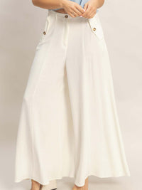 Wide-leg Flap Pocket Pants displayed on model, showcasing a stylish and polished look.