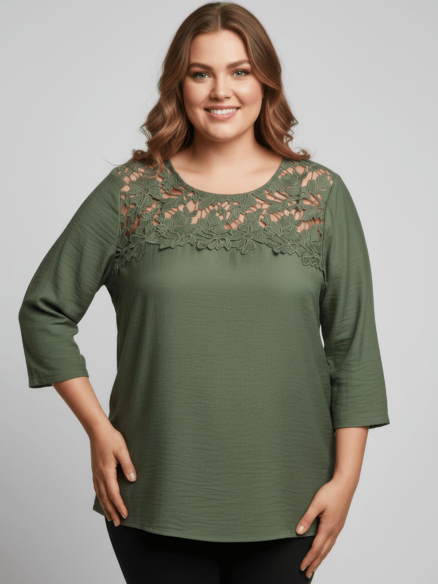 The Selma Lace Yoke Knit Top in green with floral lace yoke and three-quarter sleeves, perfect for casual outfits.