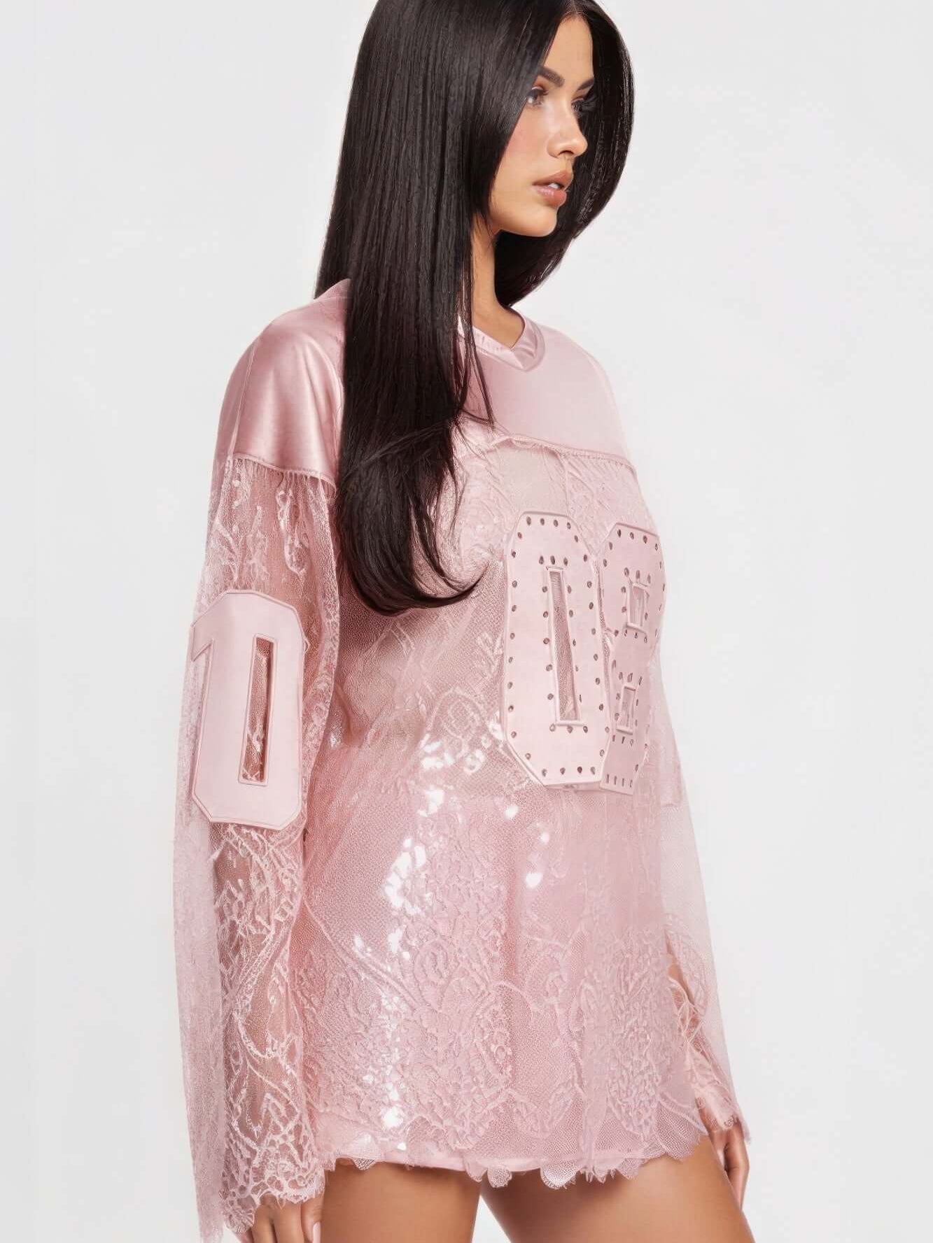 08 Long Sleeve Jersey Top featuring rhinestone graphic and lace detailing for sporty elegance.