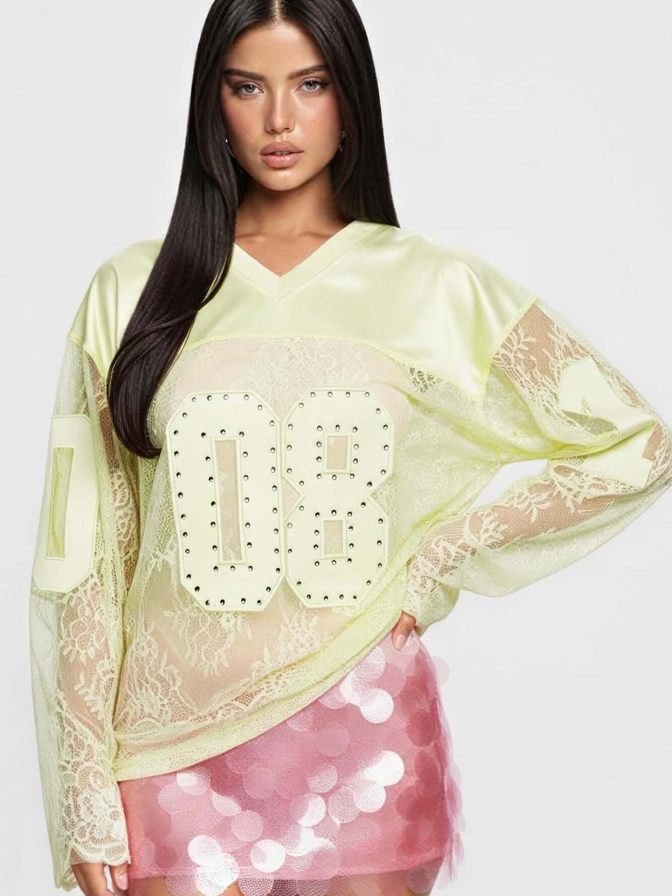 08 Long Sleeve Jersey Top featuring a V neckline, rhinestone accents, and lace detailing for a sporty style.
