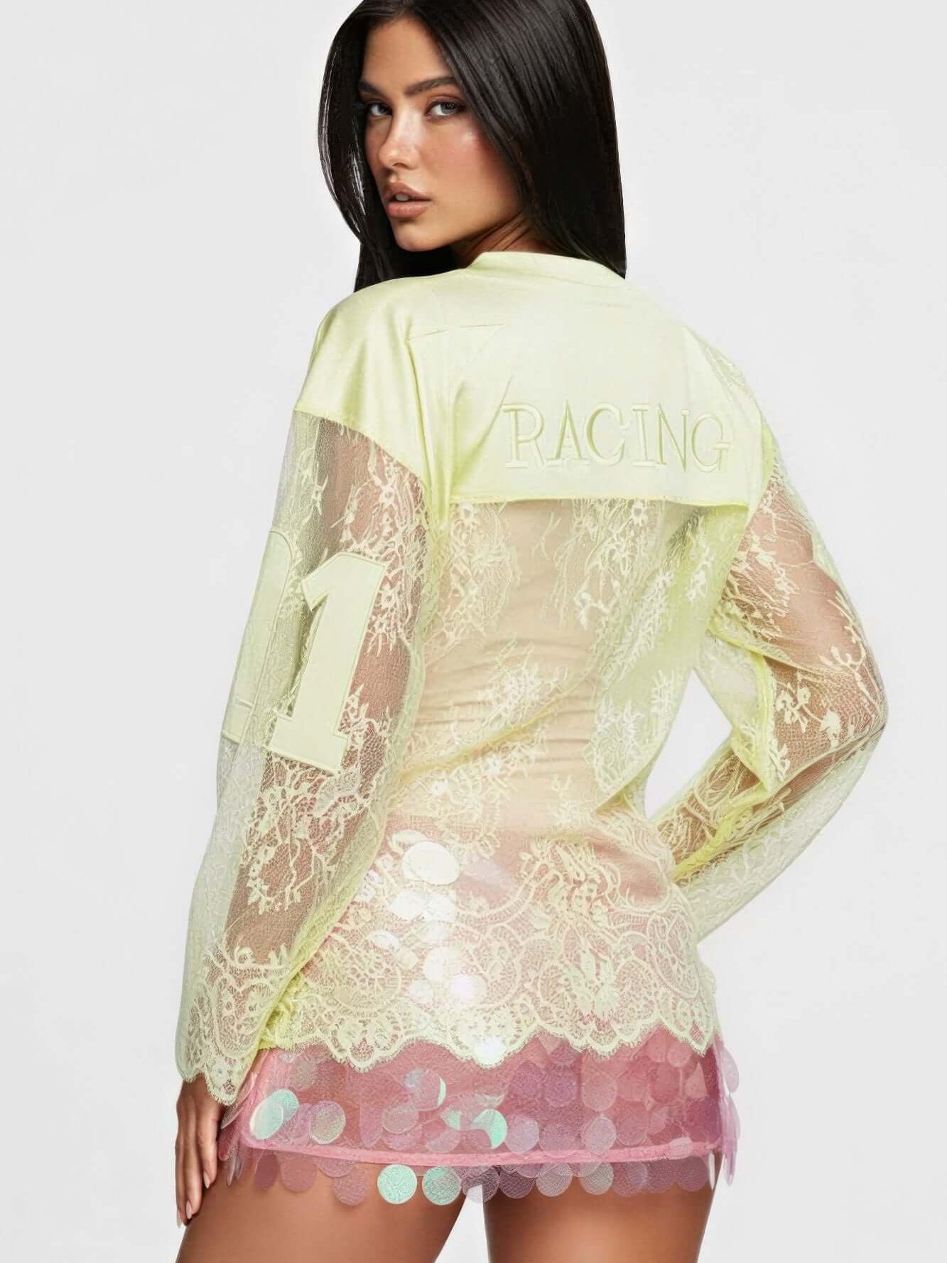 Model showcasing a stylish 08 Long Sleeve Jersey Top with lace detailing and rhinestone accents.