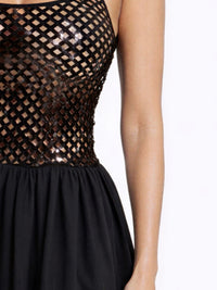 Netted Sequin Maxi Dress featuring a shimmering sequin-embellished bodice and flowing black skirt.