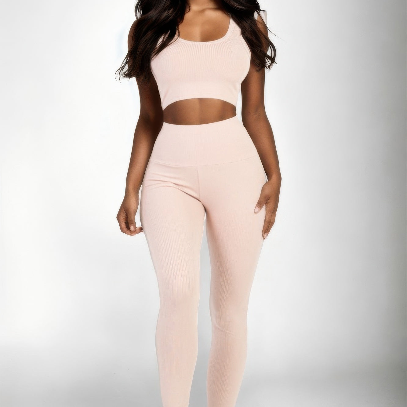 Ribbed Crop Top & Leggings Set in soft pink color, showcasing modern style and comfort for active wear.