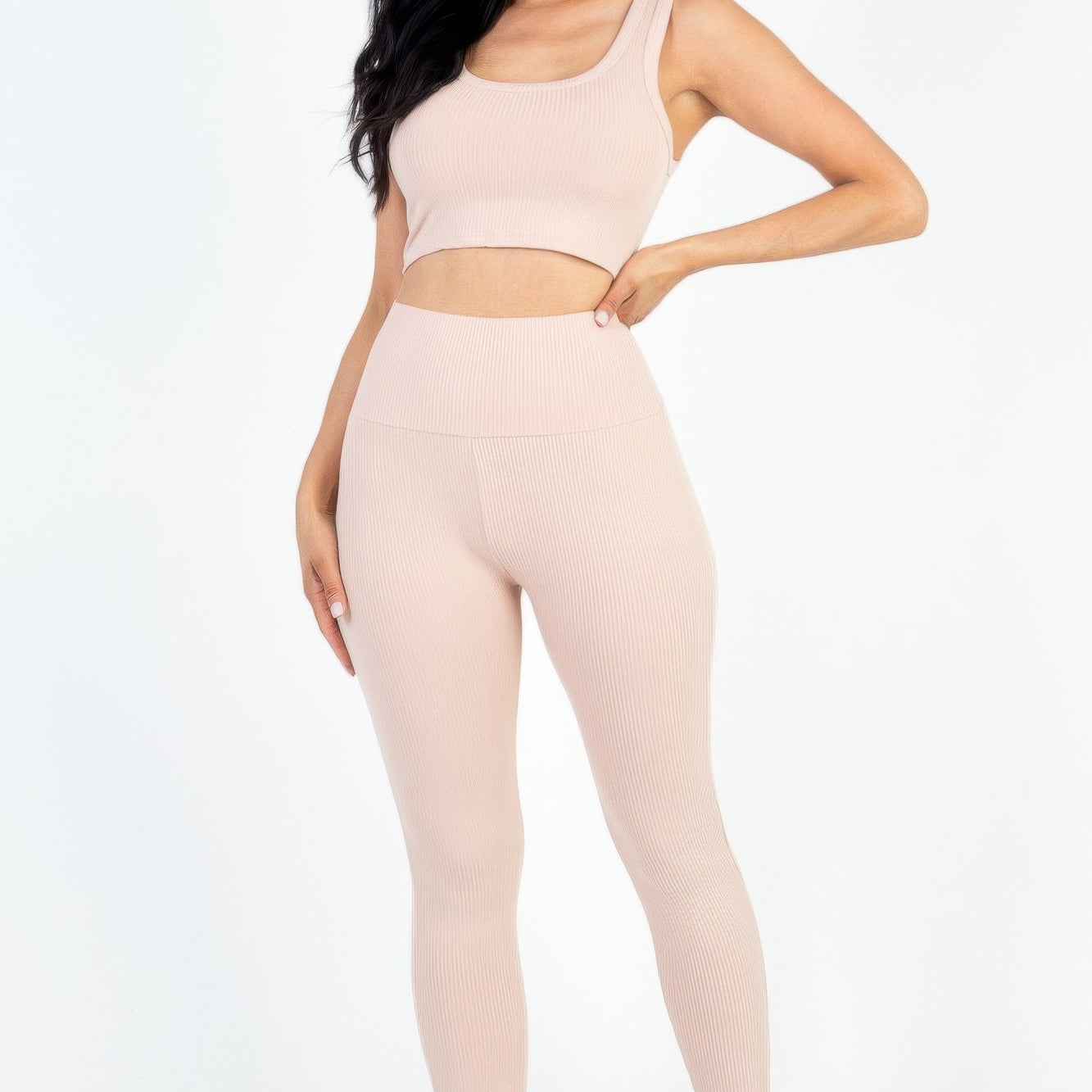 Ribbed Crop Top & Leggings Set in soft pink hue, showcasing modern style and comfort. Ideal for casual and active wear.