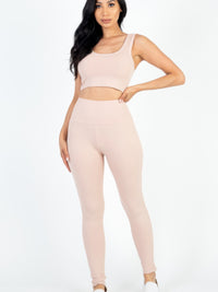 Ribbed Crop Top & Leggings Set in soft pink hue, showcasing modern style and comfort. Ideal for casual and active wear.
