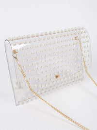 Faux Pearl Studded Transparent Envelope Clutch with pearl accents and gold chain strap, elegant accessory for any outfit.