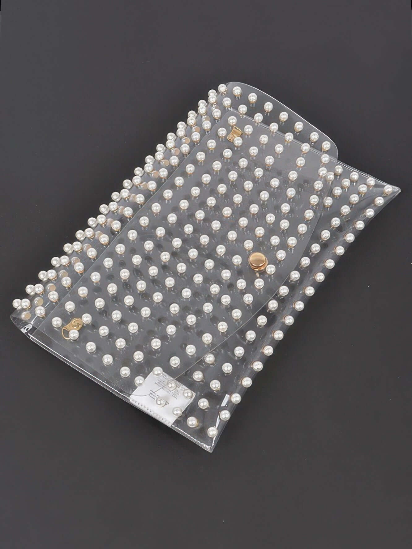 Faux Pearl Studded Transparent Envelope Clutch showcasing a clear exterior with faux pearl accents.
