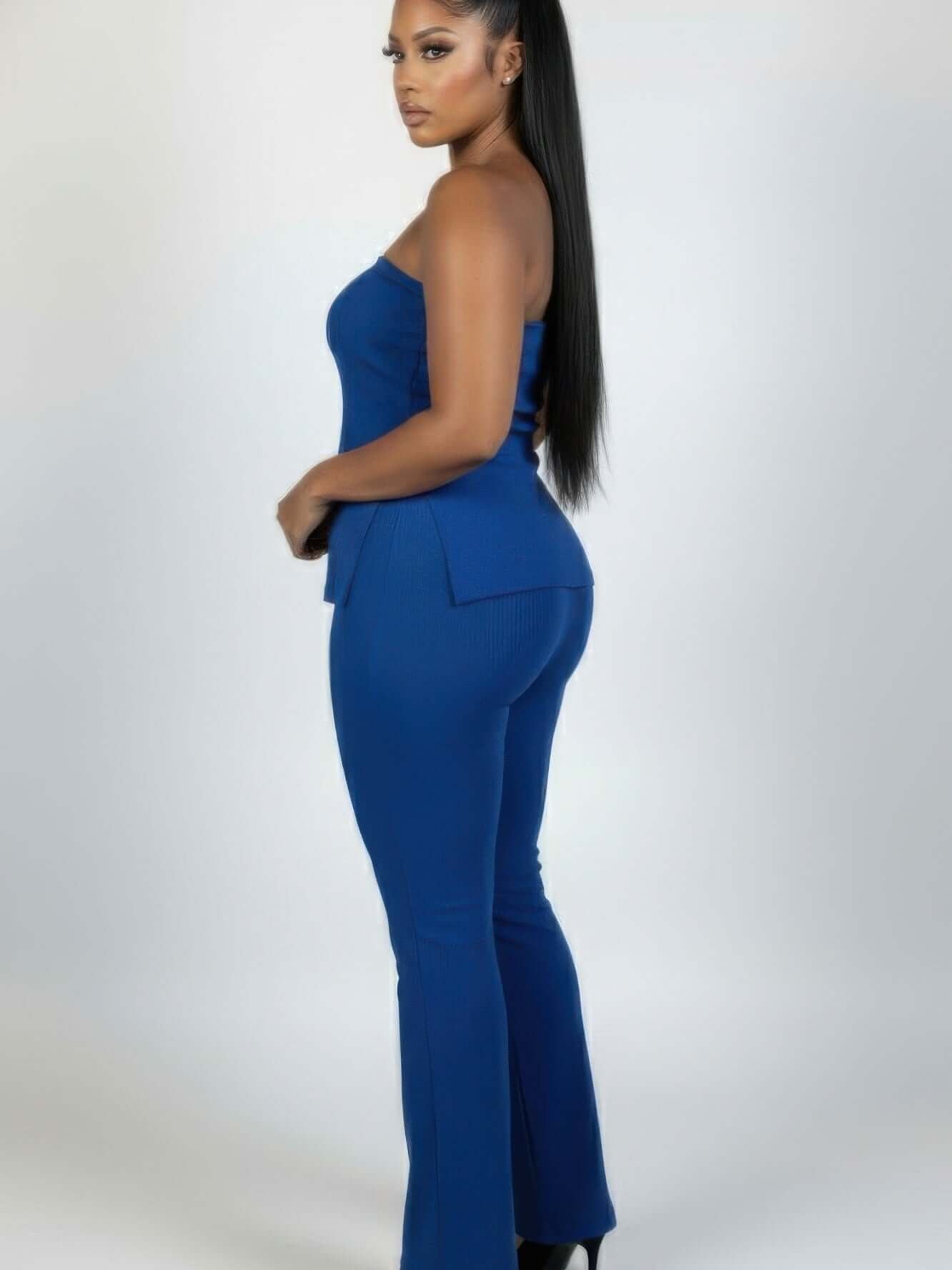 The Paloma Ribbed Tube & Flare Set, Plus Size in blue featuring a strapless tube top and high-waist flared pants.