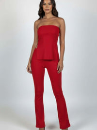 Model wearing a Ribbed Slit Tube Top & High-waist Flare Pants Set in vibrant red, showcasing a trendy and chic silhouette.