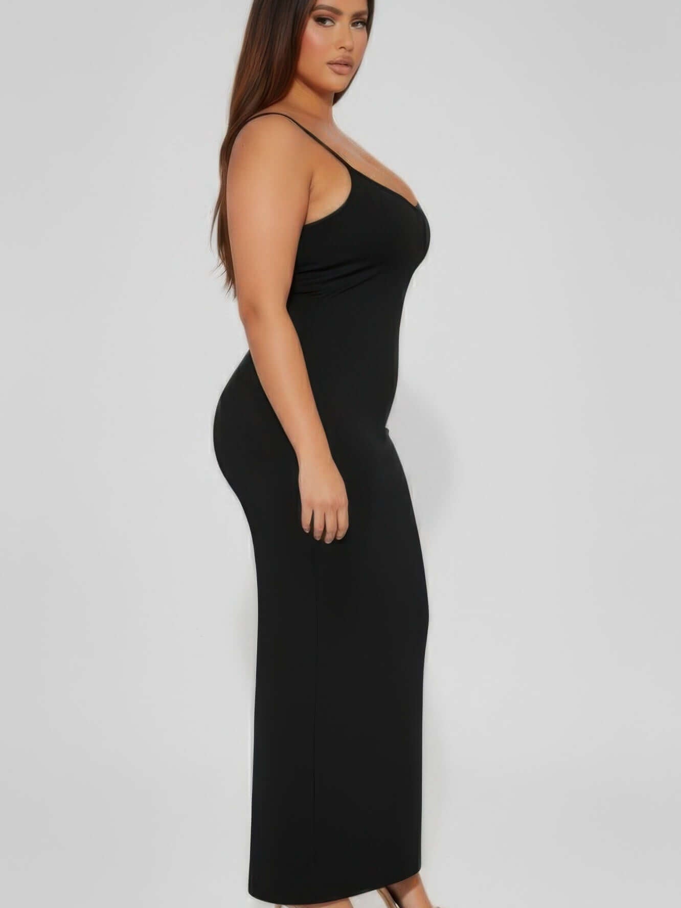The Zuri Ribbed Mermaid Cami Dress, Plus Size in black, showcasing a sleek silhouette and mermaid-flare hem.