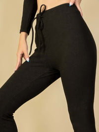 Model showcasing stylish ribbed tie front lounge leggings with a chic elastic drawstring waistband.