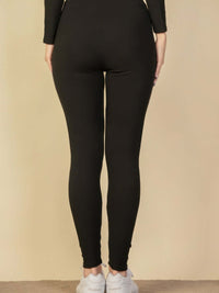 Back view of ribbed tie front lounge leggings in black, showcasing a snug fit and sleek design.