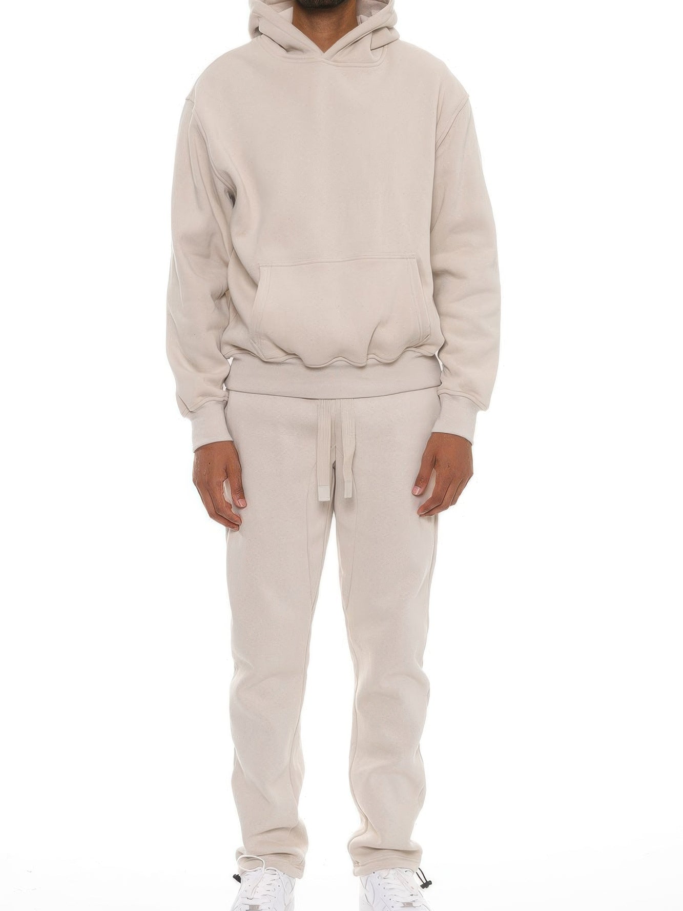 Man wearing a Premium Cotton Blend Hoodie set in beige, showcasing a comfortable oversized fit for casual style.