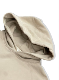 Close-up of the hood of a premium cotton blend hoodie set in a soft beige color.