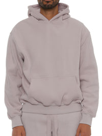 Model wearing a Premium Cotton Blend Hoodie in light gray, showcasing its relaxed fit and comfortable style.