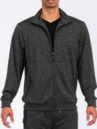 Man wearing a marbled track jacket in a sleek, modern style, perfect for athletic wear or casual outings.