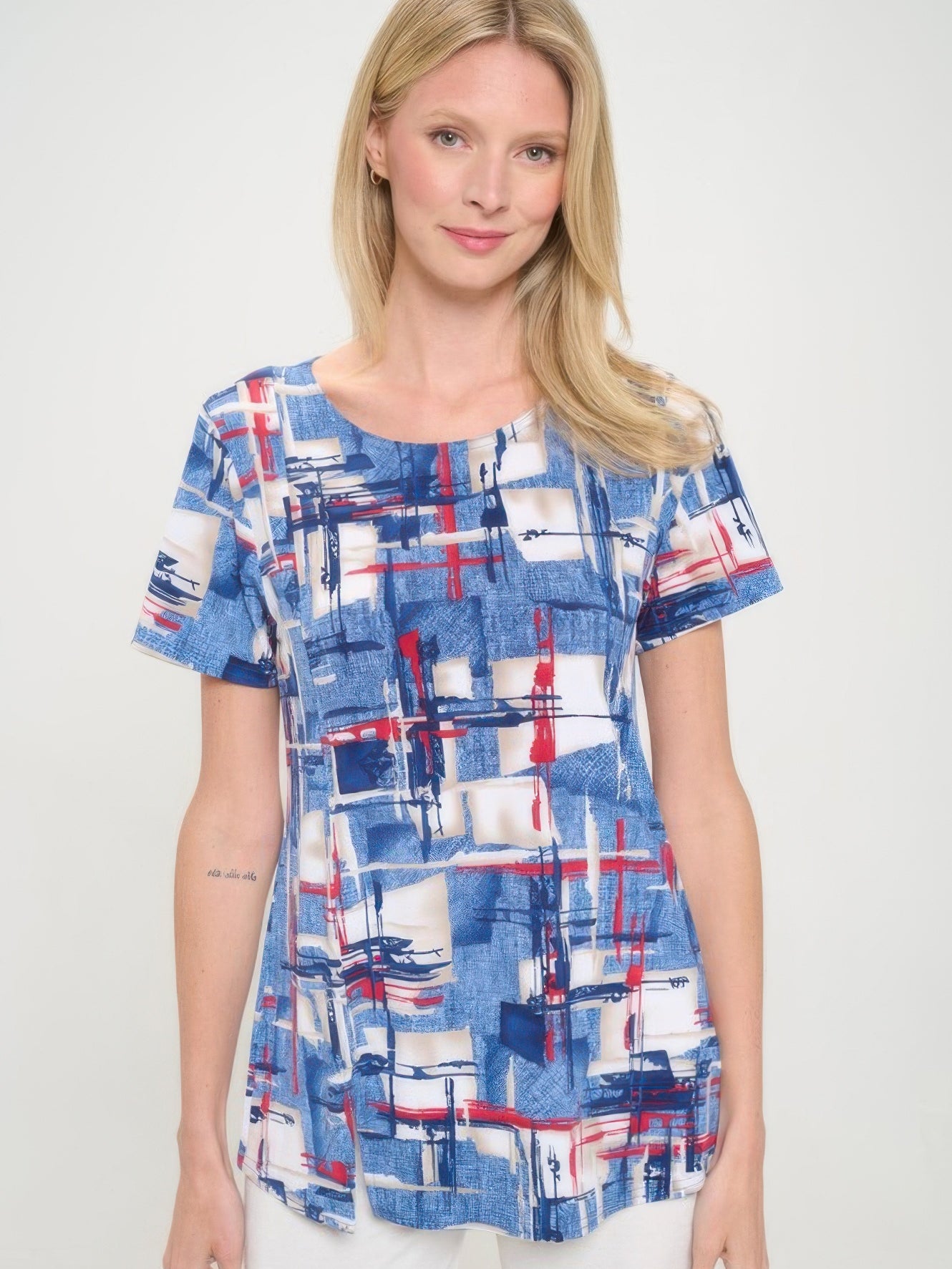 HIT Round Neck Short Sleeve Slit Top in blue and white abstract pattern, featuring subtle slits and a flattering silhouette.